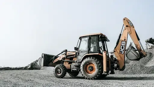 yellow JCB aggregate mining heavy equipment on a worksite