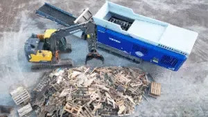 BC forestry operation using log stacker with portable stacking racks